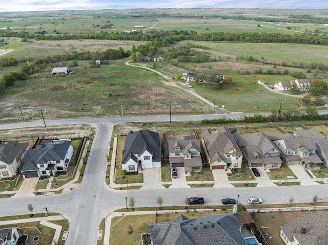 drone / aerial view with a rural view and a residential view