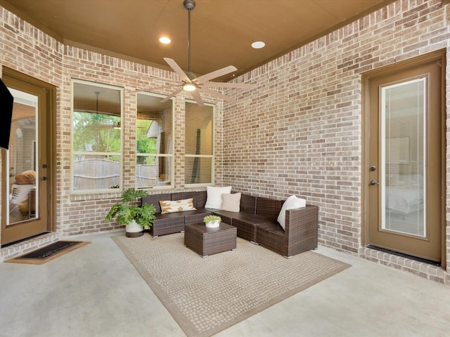 view of patio with ceiling fan and outdoor lounge area