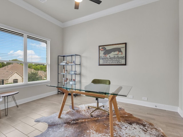office space featuring crown molding, baseboards, ceiling fan, and wood finished floors
