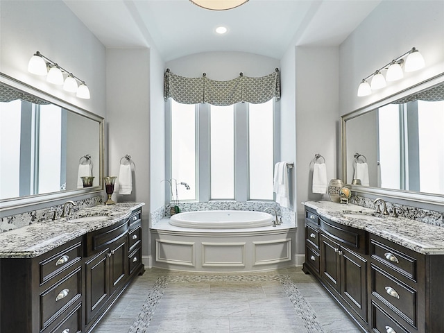 12643 Canyon Oaks Dr, Frisco, TX 75033 - full bathroom featuring two vanities and a bath