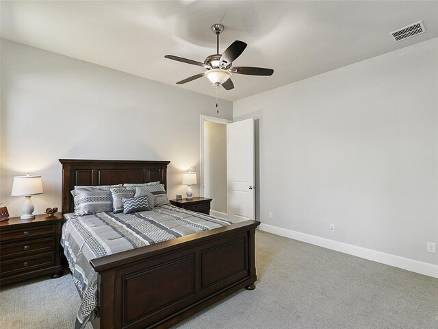 12643 Canyon Oaks Dr, Frisco, TX 75033 - bedroom featuring light carpet, baseboards, and a ceiling fan