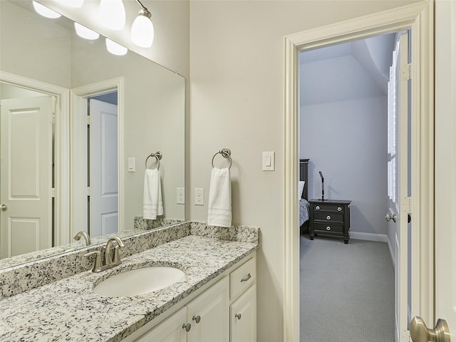 12643 Canyon Oaks Dr, Frisco, TX 75033 - bathroom with baseboards, vanity, and ensuite bathroom