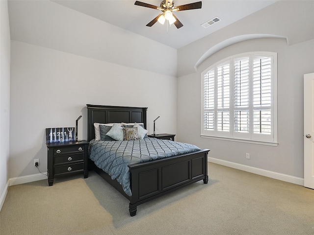 carpeted bedroom featuring visible vents, baseboards, and ceiling fan