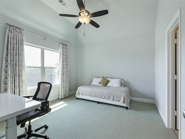 bedroom with carpet flooring, baseboards, visible vents, and vaulted ceiling