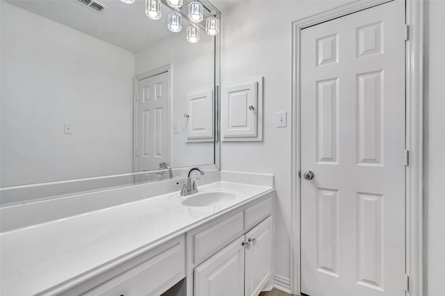 bathroom featuring vanity and visible vents