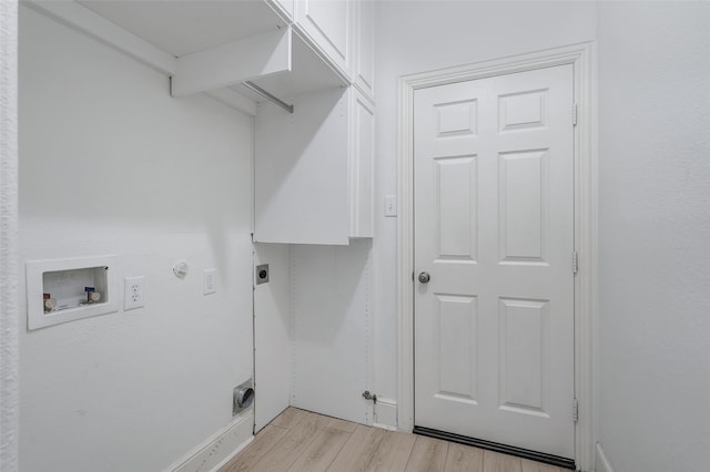 clothes washing area with baseboards, hookup for a washing machine, electric dryer hookup, light wood finished floors, and hookup for a gas dryer