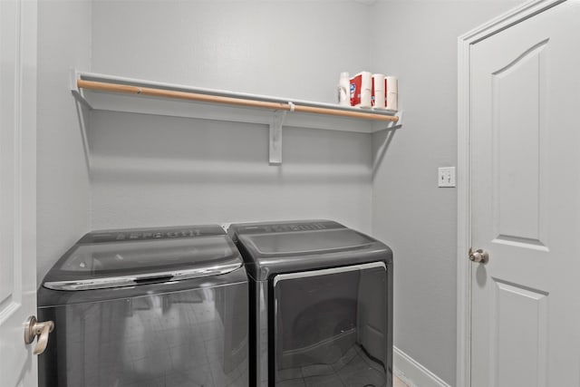 laundry area with separate washer and dryer and laundry area