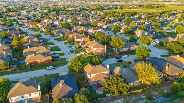 birds eye view of property with a residential view