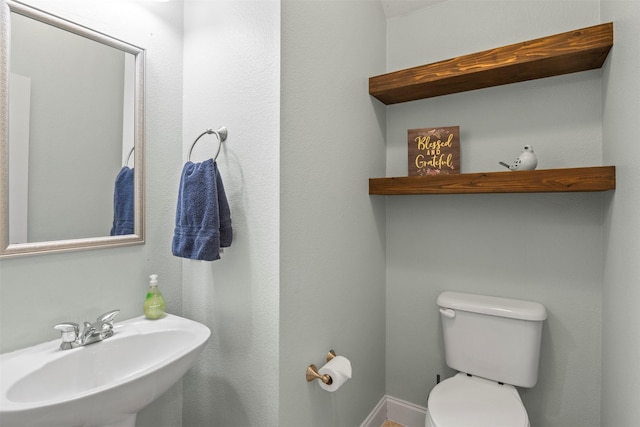 bathroom with a sink and toilet