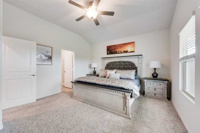 carpeted bedroom featuring baseboards, a ceiling fan, and lofted ceiling