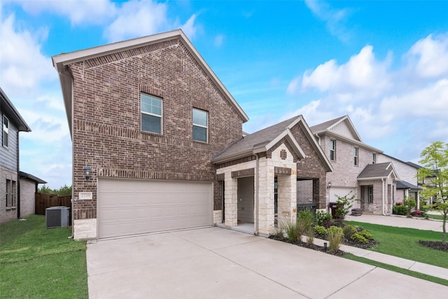 traditional home with brick siding, an attached garage, central air condition unit, and a front yard