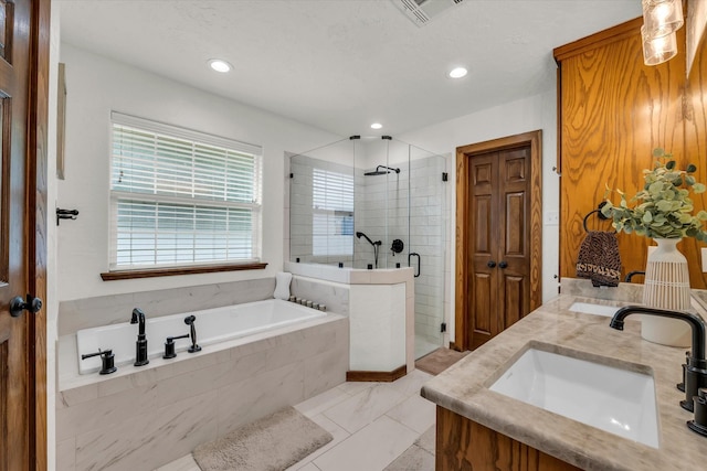 bathroom featuring a bath, visible vents, a stall shower, a sink, and recessed lighting