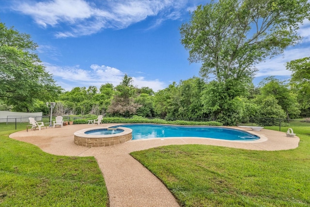 view of pool with a yard, a patio, a pool with connected hot tub, and fence