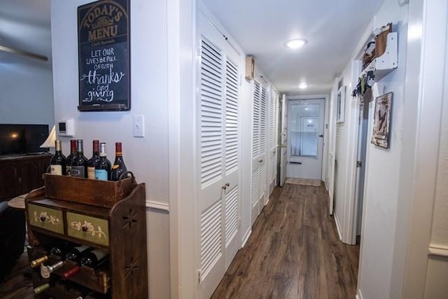 hallway with recessed lighting and wood finished floors