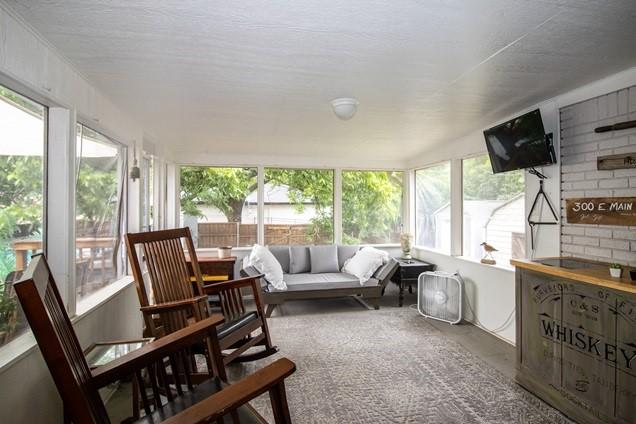 sunroom / solarium with finished concrete flooring and a wealth of natural light