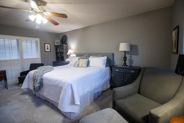 bedroom with ceiling fan and carpet flooring