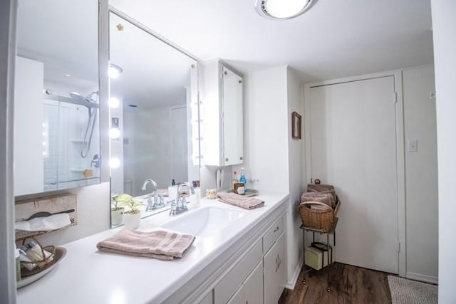 bathroom with vanity and wood finished floors