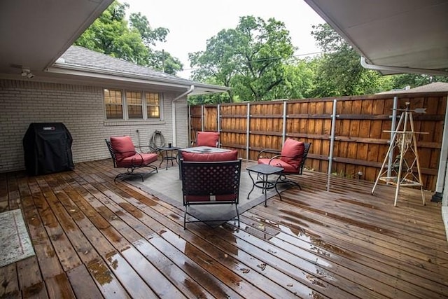 deck with fence and grilling area