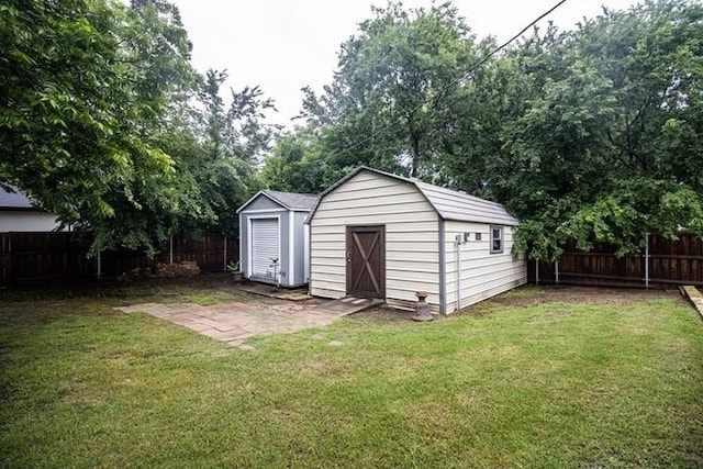 view of shed featuring a fenced backyard