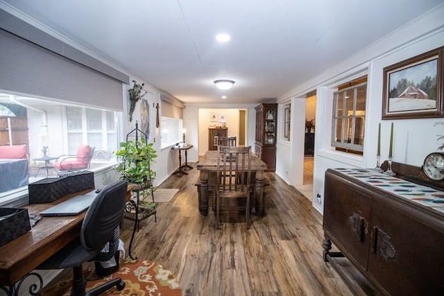 dining room featuring crown molding and wood finished floors