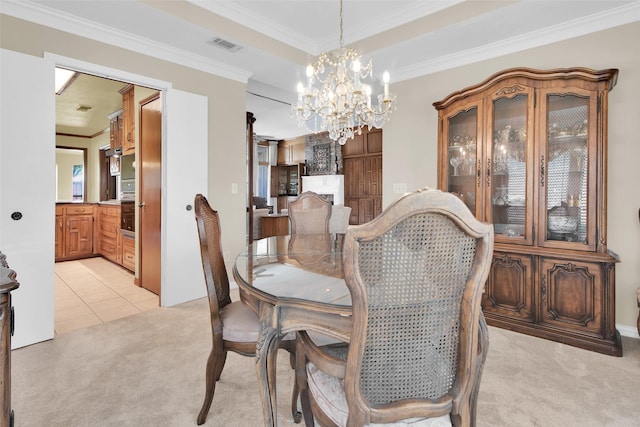 dining space featuring visible vents, crown molding, light carpet, light tile patterned floors, and a notable chandelier