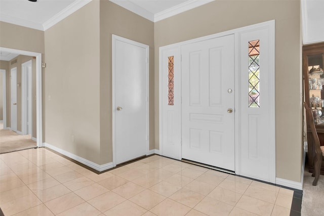 entryway with baseboards, ornamental molding, and light tile patterned floors