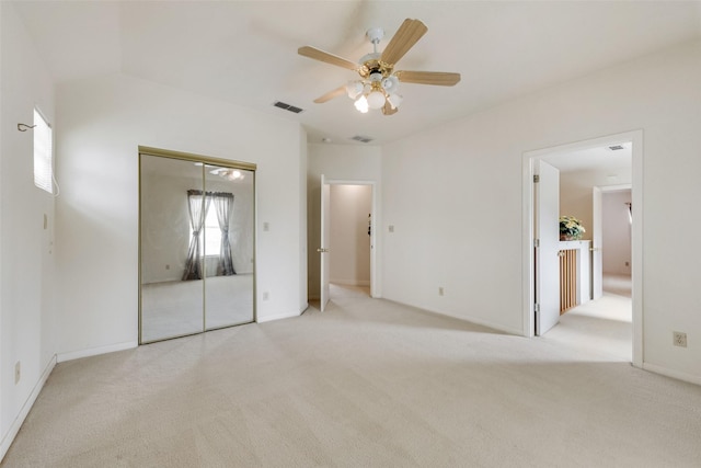 unfurnished bedroom with carpet, a closet, and visible vents