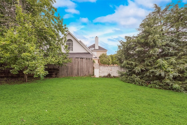 view of yard featuring fence