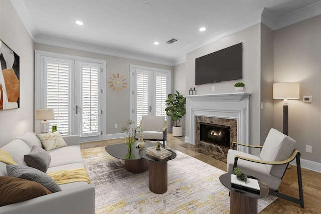 living area with crown molding, a premium fireplace, recessed lighting, and visible vents