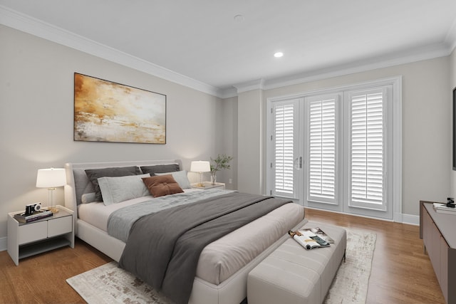 bedroom featuring crown molding, access to outside, baseboards, and wood finished floors