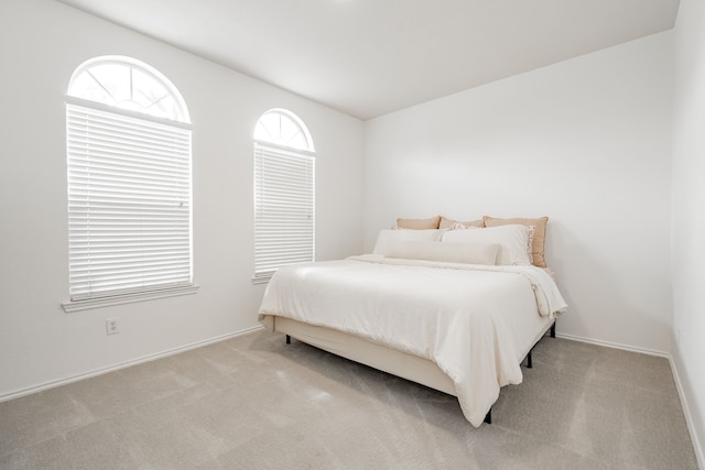 carpeted bedroom with baseboards