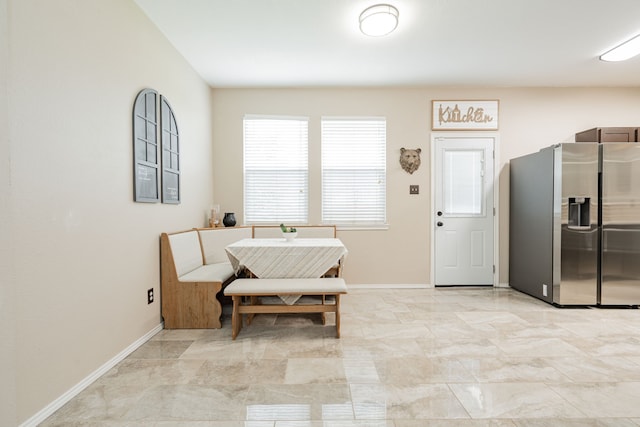 dining room featuring baseboards