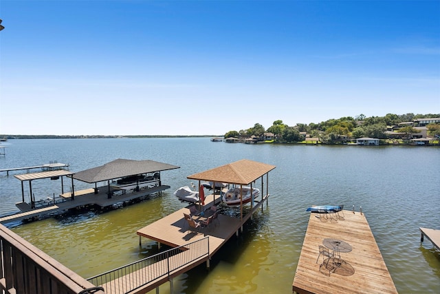 dock area featuring a water view and boat lift