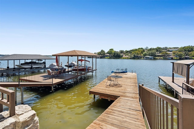 view of dock with a water view and boat lift
