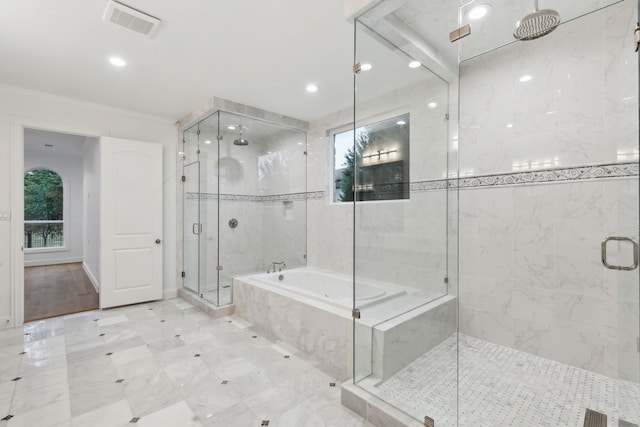 bathroom featuring ornamental molding, a garden tub, a stall shower, and visible vents
