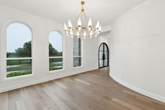 5309 Settlement Way, Mckinney, TX 75070 - unfurnished dining area with a chandelier, wood finished floors, ornamental molding, and baseboards