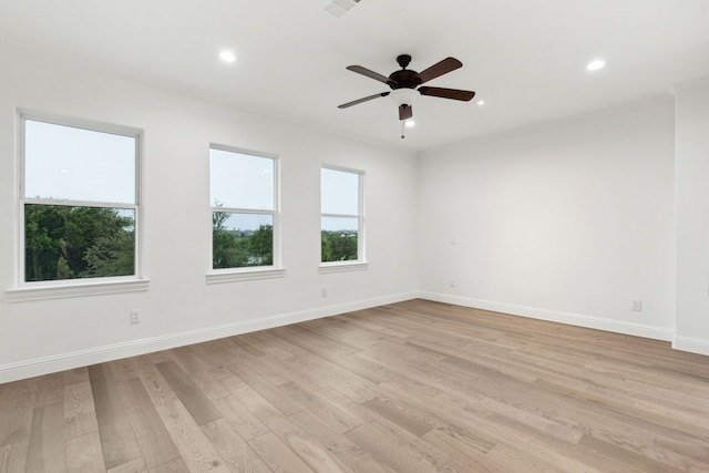 empty room with baseboards, recessed lighting, ceiling fan, and light wood-style flooring