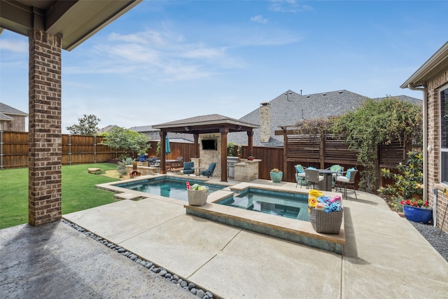 view of swimming pool with an in-ground hot tub, a gazebo, a patio area, and a fenced backyard