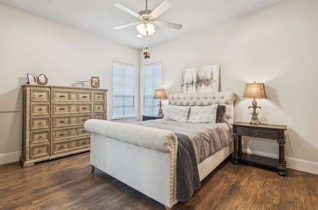 bedroom with baseboards, dark wood-style floors, and ceiling fan