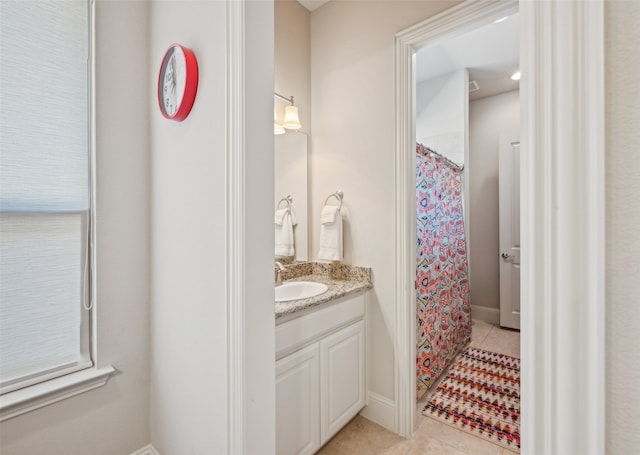 full bath featuring tile patterned flooring, vanity, and curtained shower