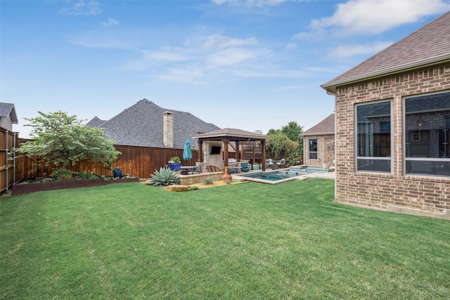 view of yard with a gazebo, a pool with connected hot tub, a patio area, and an outdoor living space