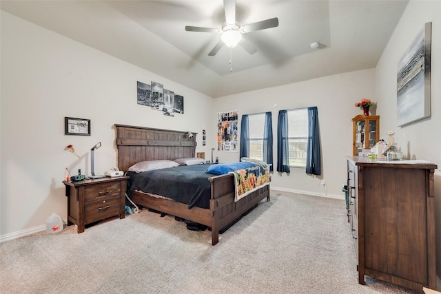bedroom featuring baseboards, a bar, a ceiling fan, and light colored carpet
