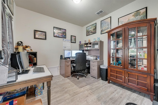 office with visible vents and light wood finished floors