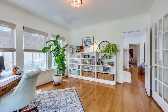 home office with crown molding and wood finished floors