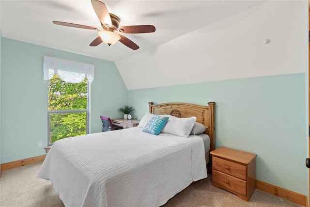 carpeted bedroom featuring baseboards, ceiling fan, and lofted ceiling