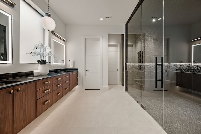 bathroom with visible vents, double vanity, recessed lighting, tile patterned floors, and a shower stall