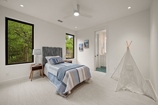 bedroom with carpet floors, baseboards, a ceiling fan, and visible vents