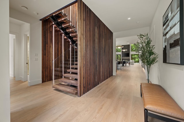corridor with stairs and light wood-type flooring