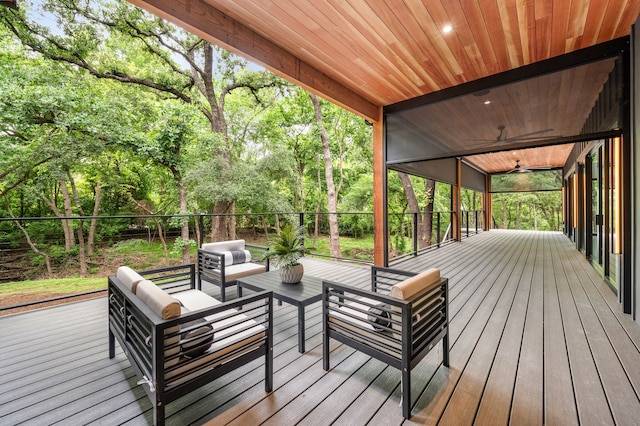 wooden deck with an outdoor living space