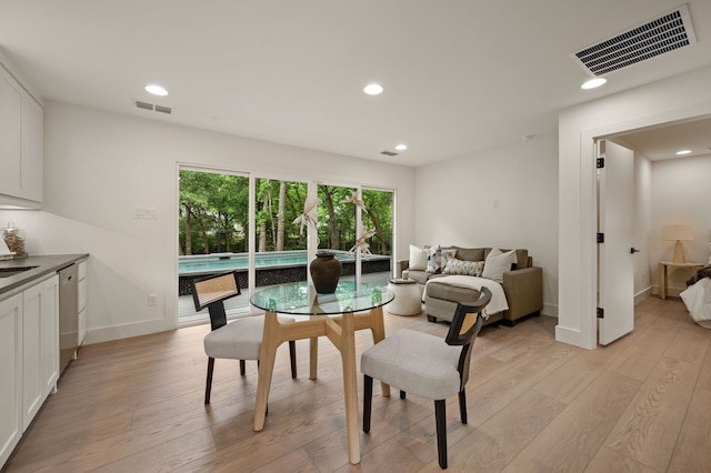 dining space with baseboards, recessed lighting, light wood-style flooring, and visible vents